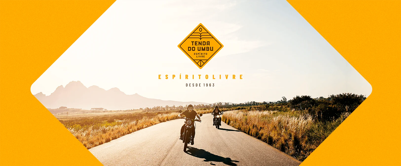 dois motociclistas na estrada com logo centro